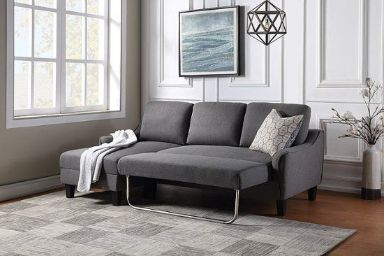 OSP Home Furnishings - Lester Sofa With Chaise and Twin Sleeper in Fabric With Black Legs - Grey